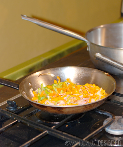 Aji Amarillo peppers and Onions Sautéing by Wanderlust Designer