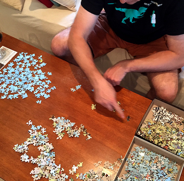 My Husband Sorting the Puzzle Pieces